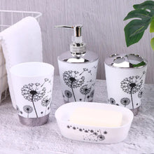 Load image into Gallery viewer, Black and White 4 piece plastic bathroom accessory set.  The design is black dandelions after the yellow flowers have left and it&#39;s just the twig left.  It has this part of the stem.  There&#39;s one soap dish, one tumbler, one lotion dispenser and one toothbrush/toothpaste holder.  It has a service count of 2 and a hole for the toothpaste.  A very cute set. The cost is $22.00