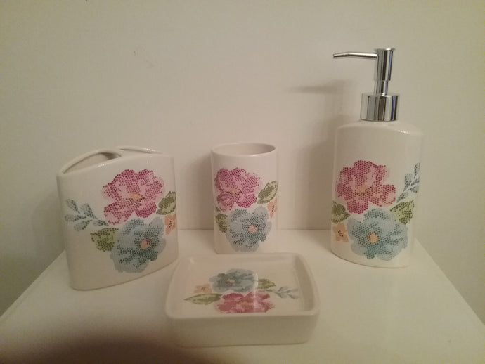 4 Piece Multi-Color Flower Bathroom Accessory Set, which includes:  Soap Dish, Lotion Dispenser, Rinse Cup and Toothbrush Holder