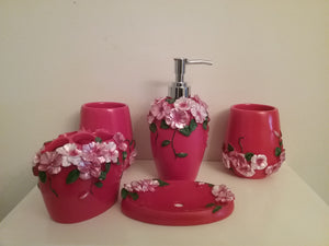 Red Bathroom Accessory Set - 5 piece red with flowers resin bathroom accessory set, which includes:  Soap Dish, Lotion Dispenser, two rinse cups and Toothbrush holder