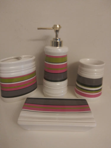 4 piece ceramic bathroom accessory set with pea green, pink, dark gray, black stripes.  The set includes:  soap dish, rinse cup, toothbrush/toothpaste holder and lotion dispenser.