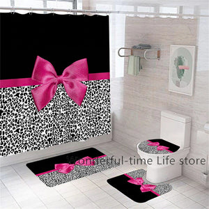 Nordic Style Black  And White Leopard Print on the bottom of shower curtain, sink mat, toilet mat and toilet seat cover.  Top of each is Black with a pink bow  tied in the middle of each piece.